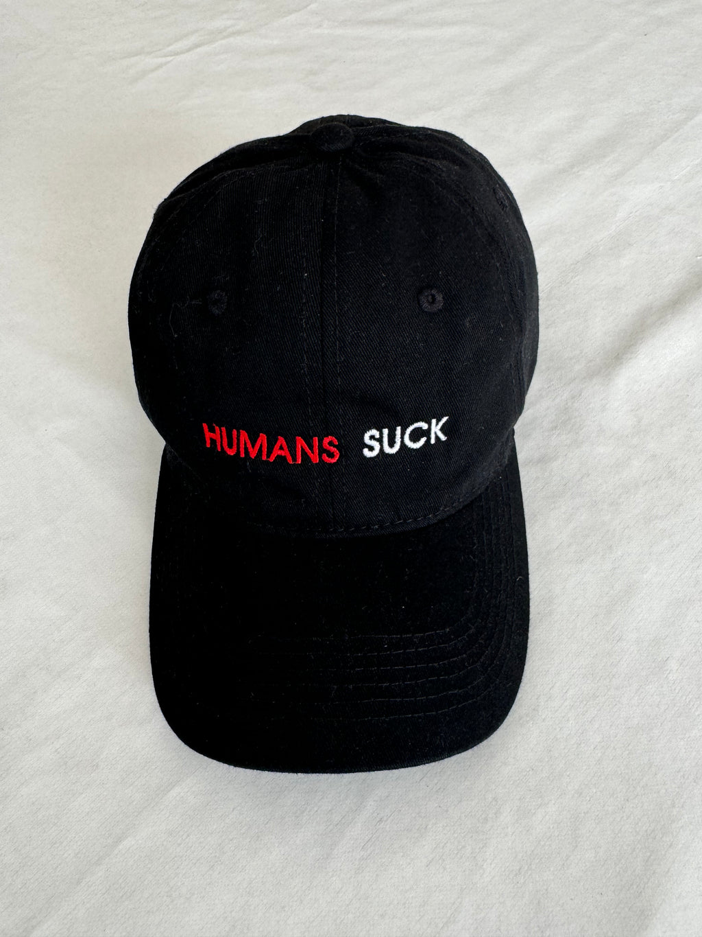 "HUMANS SUCK" cap